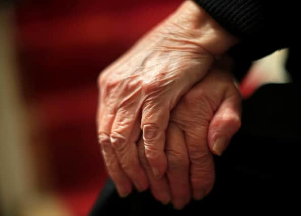 The hands of an elderly woman in Poole, Dorset. 