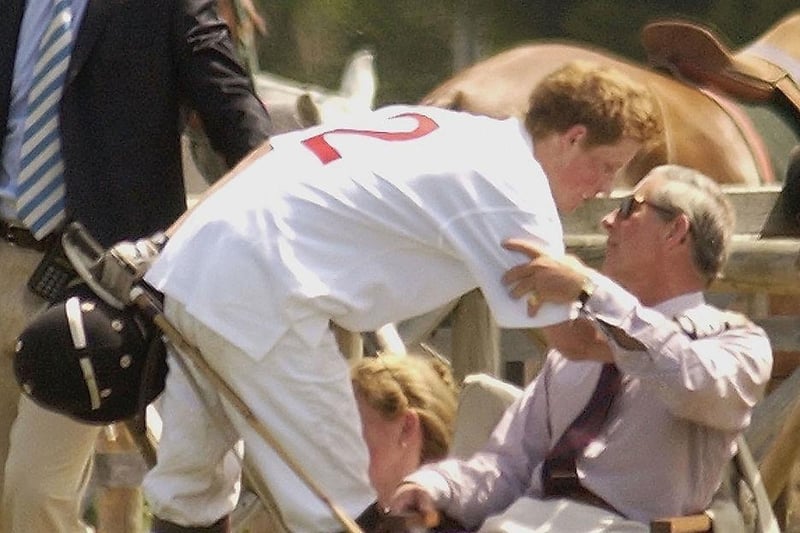 Prince Harry greets his father HRH The Prince of Wales during the National Schools Polo Tournament on June 29, 2003 in Southam.
