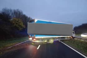 There are long traffic delays in the area after an HGV collided with the central reservation on the A46.