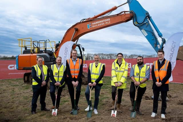 Members of the delivery team mark the official start on site