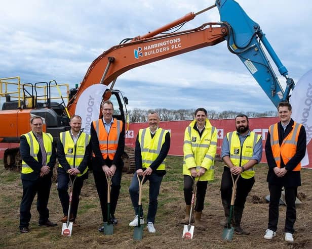 Members of the delivery team mark the official start on site