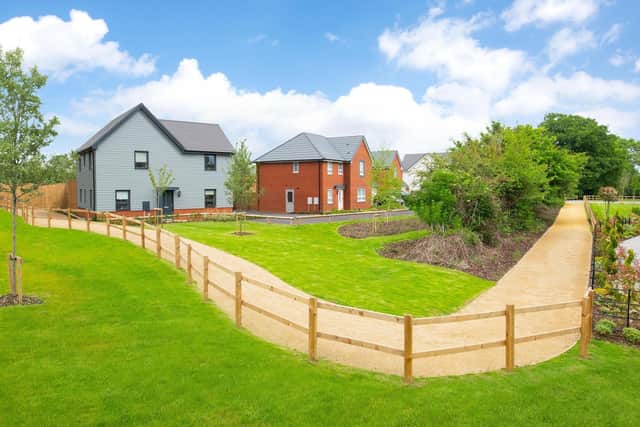 BWM - 001 BWM_AstonGrange_Warwick_Ext_Alderney_Radleigh_4bed - A street scene featuring a four bedroom home at Aston Grange