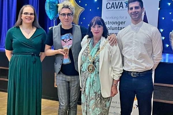 Simon pictured with his award alongside members of Out-Out and Rugby Mayor, Maggie O'Rourke.
