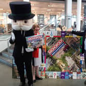 Warwick District Council Chair Cllr Sidney Syson and Leamington Mayor Cllr Alan Boad help Mr Monopoly to launch Monopoly: Royal Leamington Spa Edition at  Royal Leamington Spa College.