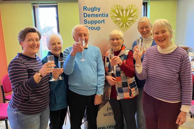 Rugby Dementia Support celebrate the award of the BEM. Jane is pictured centre right with patchwork top.