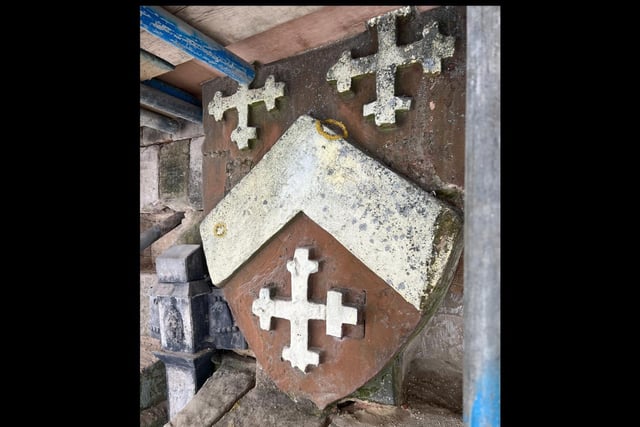 One of the heraldic shields on the church tower.