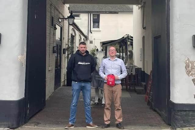 Benjamin Spann of the Change Your Life Put Down Your Knife campaign delivers one of the bleed kits to the White Horse pub in Leamington.
