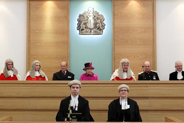 Queen Elizabeth II and Prince Philip, Duke of Edinburgh, officially open the Magistrates court at the Warwickshire Justice Centre on March 4, 2011 in Leamington Spa..