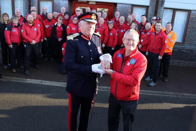 HM the King’s representative in Warwickshire, Lord Lieutenant Tim Cox, presents the King's Award for Volunteering to the Warwickshire Search and Rescue team. Picture courtesy of Warwickshire Police.
