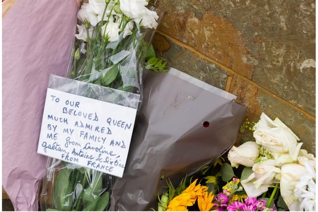 Tributes have been laid outside Shire Hall in Warwick. Photo by Mike Baker