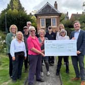 The Hill Close Gardens team receiving the cheque from a representative from Hansgrohe UK. Photo supplied