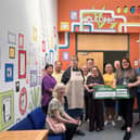 The team at the SYDNI Centre in Sydenham have been able to paint and refurbish the main hall and the youth centre for the many groups in the community that use them. Photo supplied. Photo shows Morrisons community champion Alex Pearson with the team at the SYDNI Centre. Photo supplied