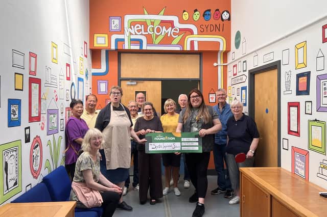 The team at the SYDNI Centre in Sydenham have been able to paint and refurbish the main hall and the youth centre for the many groups in the community that use them. Photo supplied. Photo shows Morrisons community champion Alex Pearson with the team at the SYDNI Centre. Photo supplied