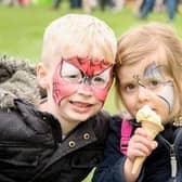 A picture from our library of children enjoying Rugby Spring Fair.