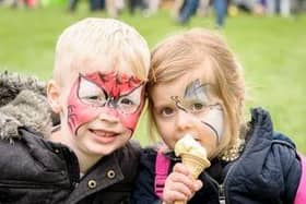 A picture from our library of children enjoying Rugby Spring Fair.