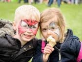A picture from our library of children enjoying Rugby Spring Fair.