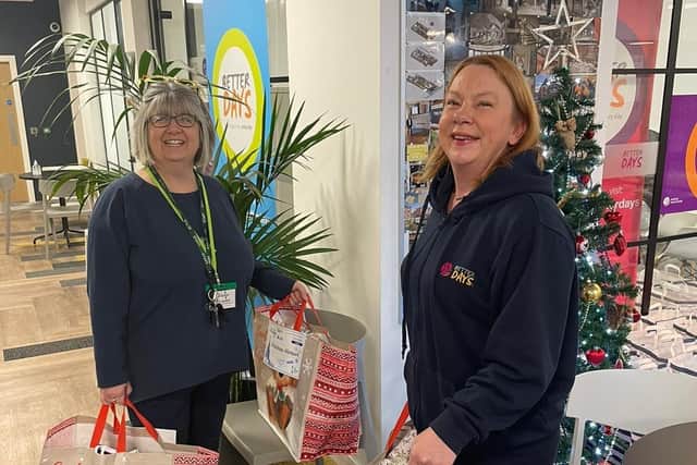 Kate Morris, Foodbank Manager and Orbit’s Place Area Lead, Cheryl Flavell with Christmas food hamper