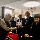 Rusty with RAFA chairman Stuart Powney and Treasurer Patrick Fitzgerald and his daughters Alison and Kathryn Rusty with daughters Alison and Kathryn Rusty and his cake. Picture supplied.