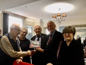 Rusty with RAFA chairman Stuart Powney and Treasurer Patrick Fitzgerald and his daughters Alison and Kathryn Rusty with daughters Alison and Kathryn Rusty and his cake. Picture supplied.