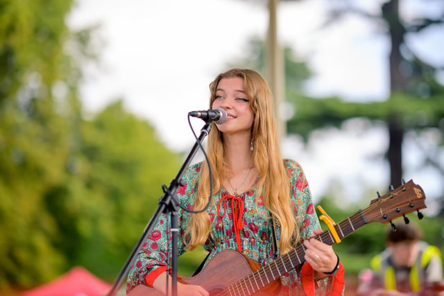 Singer Abi Rowberry performing on the bandstand.