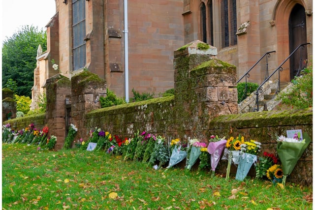 Floral tributes left next to St Nicholas Church in Kenilworth. Photo by Mike Baker