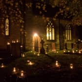 Hundreds of candles adorn the churchyard for Night of Our Light.