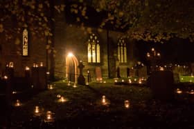 Hundreds of candles adorn the churchyard for Night of Our Light.