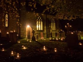 Hundreds of candles adorn the churchyard for Night of Our Light.