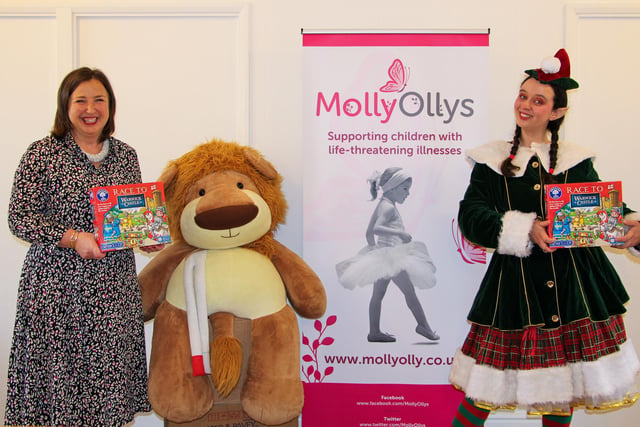 The castle donated 200 boxes of toys to Molly Ollys, which supports children with life-threatening illnesses and their families. Castle staff and Bow the elf visited the charity to hand-deliver the games. Photo by Warwick Castle