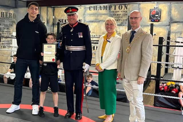 Shane Kavanagh receives his award from Lord Lt Tim Co, Warwickshire Deputy Police & Crime Commissioner Emma Daniell, WDC leader Cllr Rob Margrave & Lewis Williams.