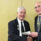 Warwick Rotary Club President Keith Talbot (right) with Alistair Price wearing his father’s medals (left). Photo supplied