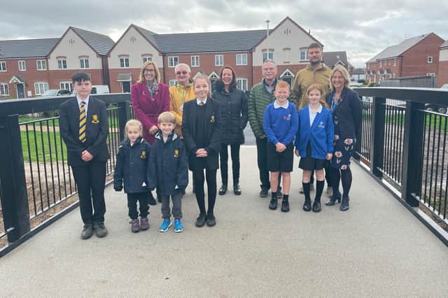 A new bridge over Gog Brook in Warwick is now open to the public following extensive works by Warwickshire County Council.
Cllr John Holland is pictured with representatives from Aylesford School and Newburgh Primary School.
