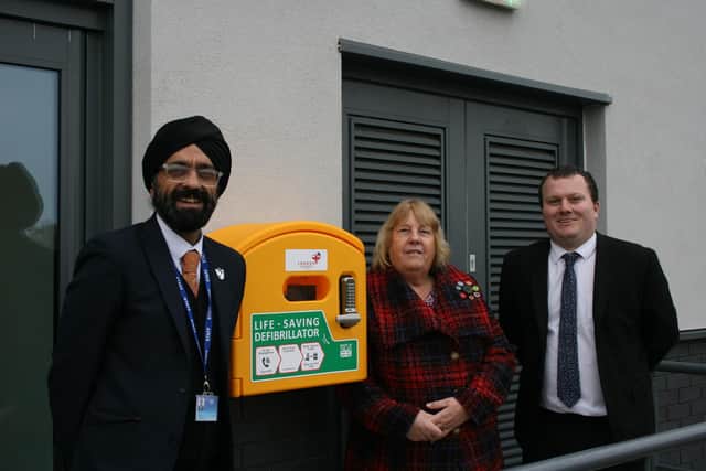 Whitnash Councillor and Campion School Governor, Judy Falp, visited the school to see the new defibrillator in situ along with Headteacher Jassa Panesar and Assistant Head Nick Hawkins. Picture supplied.