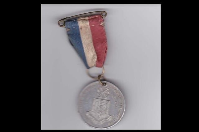 Copy of a Coronation Medal 1911, presented by Mayor Harold Mason on June 22, 1911.