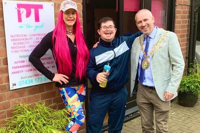 Glenique Frank with Bobby and Rugby Mayor Simon Ward.