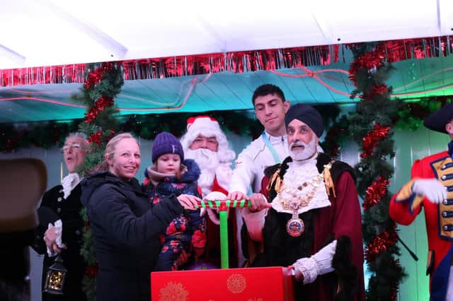 Flo and her Mum were invited on to the stage at the Warwick Victorian Evening to switch the lights on with the Mayor of Warwick, Councillor Parminder Singh Birdi, and
Commonwealth Games Gold medallist Lewis Williams. Photo supplied