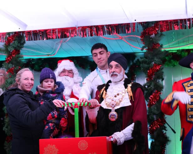 Flo and her Mum were invited on to the stage at the Warwick Victorian Evening to switch the lights on with the Mayor of Warwick, Councillor Parminder Singh Birdi, and
Commonwealth Games Gold medallist Lewis Williams. Photo supplied