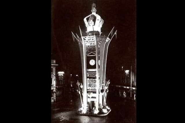 The town's iconic Clock Tower bathed in lights and topped with a giant crown to mark the coronation of Queen Elizabeth II.