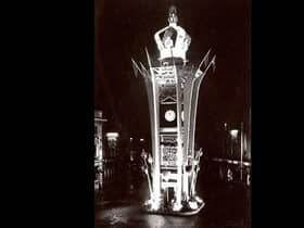 The town's iconic Clock Tower bathed in lights and topped with a giant crown to mark the coronation of Queen Elizabeth II.