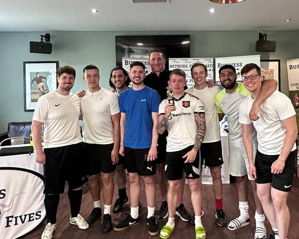 The winning Burgis and Bullock team with their Coventry Business Fives winner trophy presented by Chris Kirkland. Photo supplied