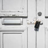 NOTE: IMAGE 12 OF A SET OF 35 IMAGES FEATURING LOCKED GATES OF BUSINESSES AND PLACES THAT ARE CLOSED DURING UK LOCKDOWN A black combination lock secures a hasp on a door to a puzzlair escape game centre in Bristol to prevent access as the UK continues in lockdown to help curb the spread of the coronavirus.
