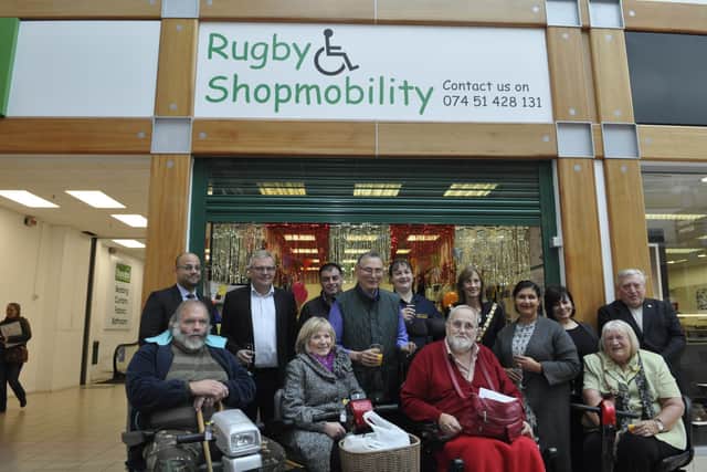 David (in his favourite colour red) with the Shopmobility team.