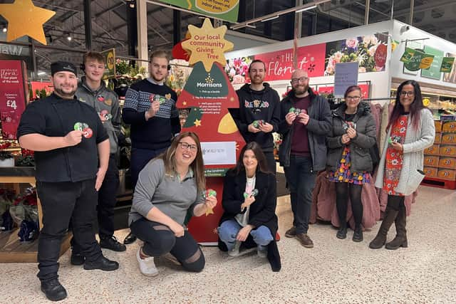 Store manager Rob Apted, Eli Whitlock, Jason Malin and Community Champion Alex Pearson with team members from the LWS Nightshelter. Photo supplied