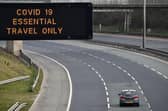 A motorway sign on the M8 advising on essential travel only (Photo: Jeff J Mitchell/Getty Images)