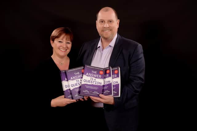 Laura Ashley-Timms and Dominic Ashley-Timms with their book The Answer is a Question: The Missing Superpower that Changes Everything and Will Transform Your Impact as a Manager and Leader. Picture supplied.