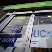 A Universal Credit sign on a door of a job centre plus in east London. Recipients of Universal Credit (UC) have described feeling "pushed beyond limits" due to the impact of cuts. A £20-per-week uplift to the benefit that was introduced at the start of the coronavirus pandemic ended on Wednesday, leaving recipients of UC £1,040 worse off per year. Picture date: Wednesday October 6, 2021.