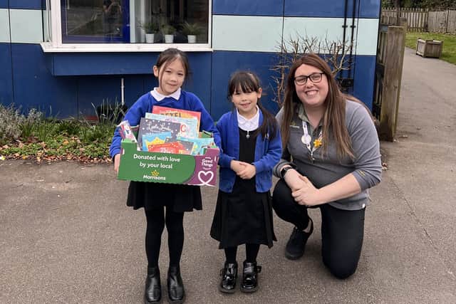 Morrisons Community Champion Alex Pearson with two pupils from Kingsway Primary School. Photo supplied
