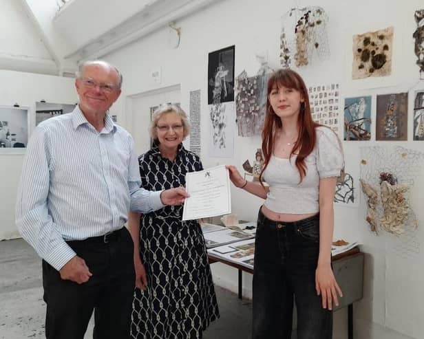 Keith Roberts is pictured left with Edwina Rowe (co-ordinator of community arts) and award-winning student Grace Gardiner Leamington. Picture supplied..