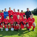 Triumph Athletic FC’s U15s team and coaches at the Standard Triumph Sports Ground off Tanners Lane