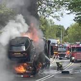 Firefighters dealing with the car transporter fire.